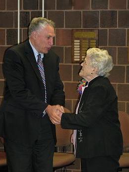 Betty Lane and Stuart Steiner shaking hands